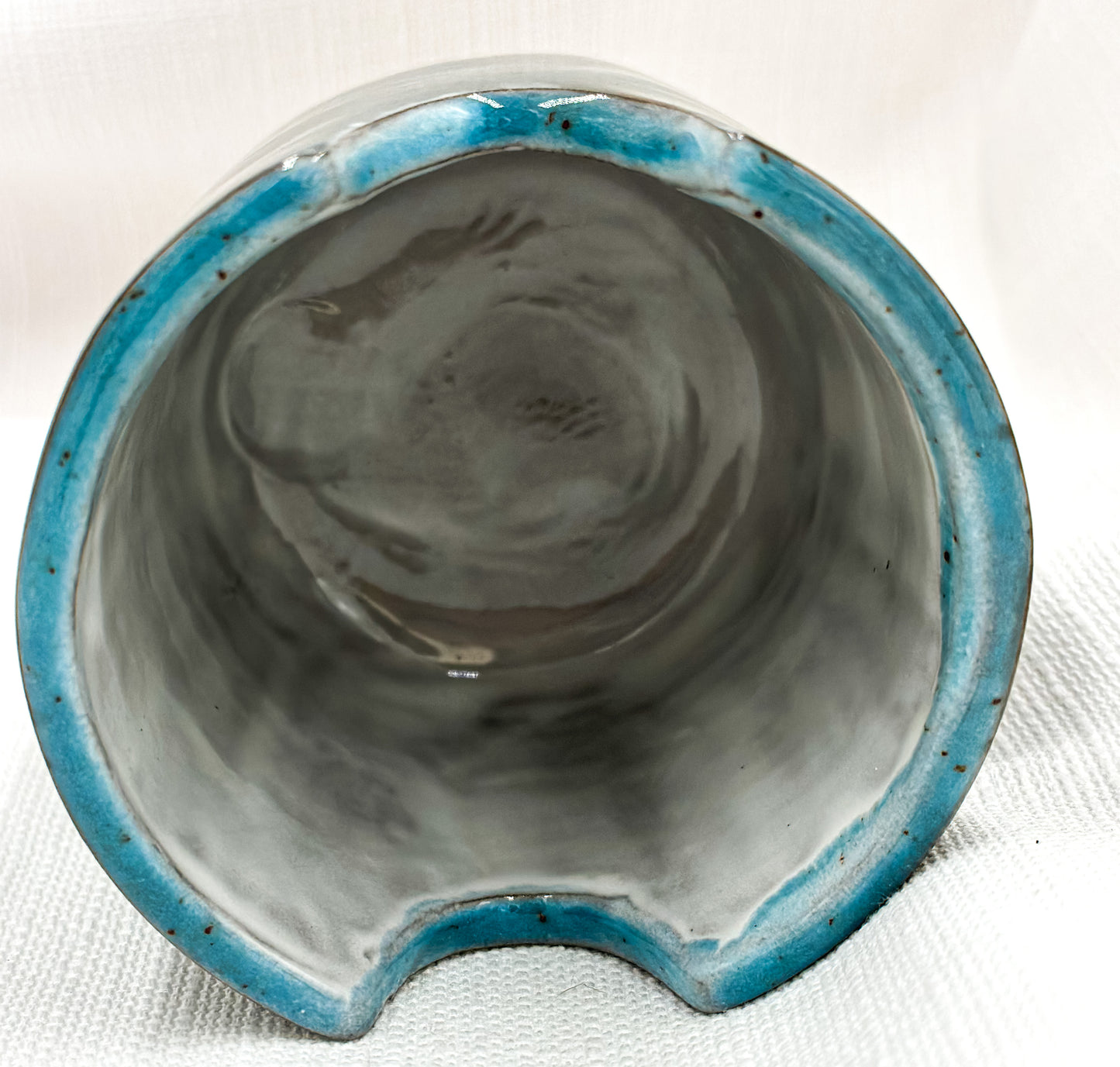 Big dark blue artist’s pot for brushes